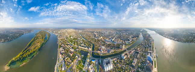 Astrakhan, Russia. Panorama of the city from the air in summer. The Volga River and Gorodstoy Island. Panorama 360. Aerial view - obrazy, fototapety, plakaty
