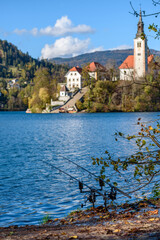 Fototapeta na wymiar Fishing rods on shore of lake Bled on an autumn day in Slovenia