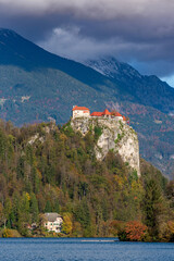 Fototapeta na wymiar Castle on cliff above Bled lake in Slovenia
