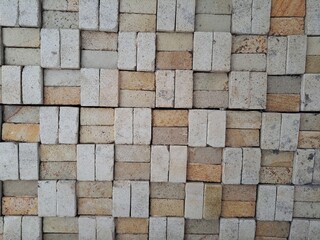 texture background wallpaper with a woven with rectangular stones for decorating houses or buildings