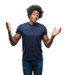 Afro american man over isolated background clueless and confused expression with arms and hands...