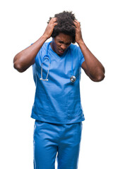 Fototapeta premium Afro american surgeon doctor man over isolated background suffering from headache desperate and stressed because pain and migraine. Hands on head.