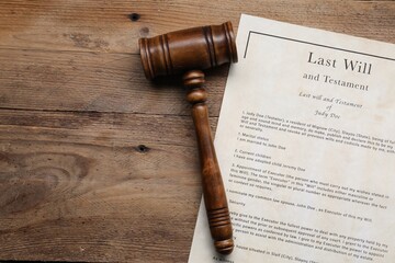 Last Will and Testament with gavel on wooden table, top view. Space for text