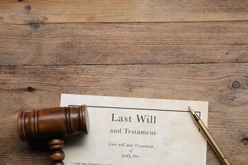Last Will and Testament, gavel and pen on wooden table, top view. Space for text