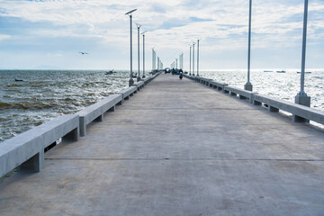 CHONBURI, THAILAND - October, 15, 2023: Concrete bridge pier fishing in the sea.