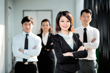 Chinese Business woman with her team.