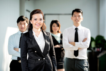 Chinese Business woman with her team.