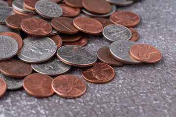 American coins and US dollars on a wooden table