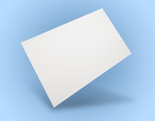 Blank business card in air on light blue background. Mockup for design