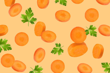 Fresh carrot slices and green parsley falling on light orange background