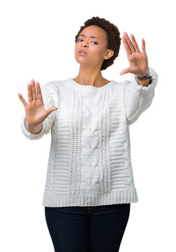 Beautiful young african american woman wearing sweater over isolated background Smiling doing frame using hands palms and fingers, camera perspective