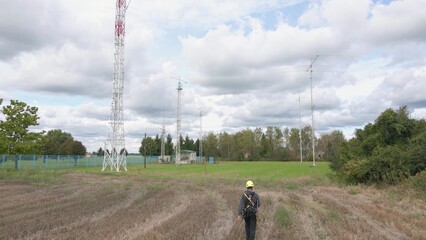 Telecommunication engineer going to 5G site for tower repair and maintenance