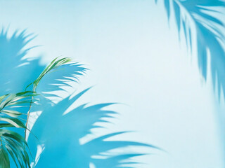 Fototapeta na wymiar Palm leaves on a light bluegreen background toned template for text panorama with copy space 