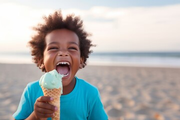 Cute african american boy holding an ice cream on the beach in summer. Kid with gelato concept with copy space - obrazy, fototapety, plakaty