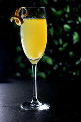 a glass of orange champaign