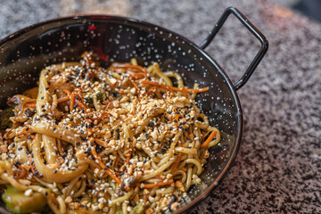 Seafood pasta. A plate of tagliolini with mussels, shrimps, clams and squids.Sea food pasta dinner, Noodle paella. Typical Catalan dish made with noodles and seafood