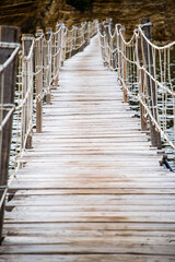 wooden footbridge leading to the small island of Agios Sostis on Zakynthos, Greece, during a sunny summer day