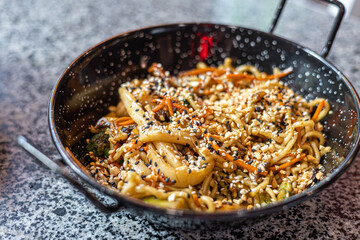 Seafood pasta. A plate of tagliolini with mussels, shrimps, clams and squids.Sea food pasta dinner, Noodle paella. Typical Catalan dish made with noodles and seafood