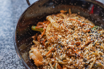 Seafood pasta. A plate of tagliolini with mussels, shrimps, clams and squids.Sea food pasta dinner, Noodle paella. Typical Catalan dish made with noodles and seafood