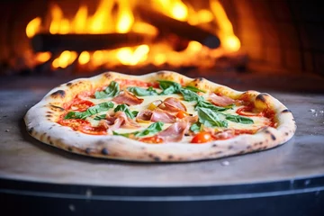 Foto op Plexiglas wood-fired pizza in a brick oven, flames visible © primopiano