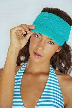 Young Woman Wearing Blue Visor Hat
