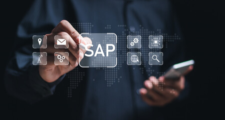 SAP or ERP enterprise resources planning system concept - Person touch virtual SAP icons for...
