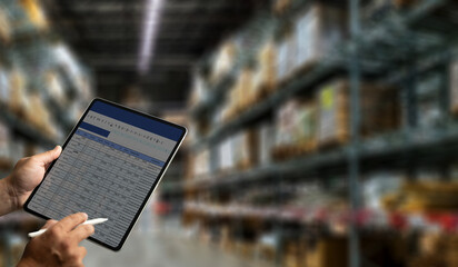 Fototapeta na wymiar Warehouse management engineer holding tablet management dashboard Electronic inventory management concept