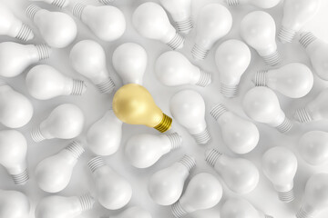 Unique ideas and different concepts. One golden bulb stands out from many white bulbs on white background. new creative, business, and innovations