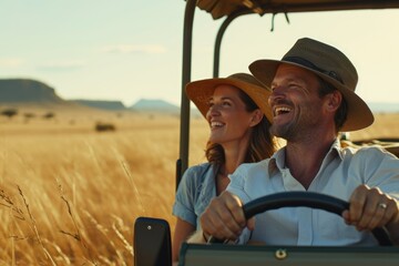 Smiling and happy couple on safari in Africa - obrazy, fototapety, plakaty