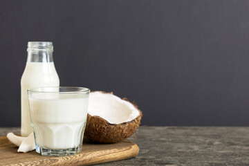 coconut products on white wooden table background. Dairy free milk substitute drink, Flat lay healthy eating