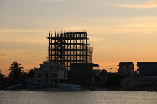sunset in the city and silhouette of buidling