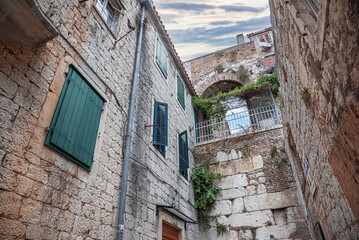 Fototapeta na wymiar Ancient stone buildings on the streets of Split in Croatia.