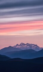 Obraz premium Serene Sunset over Snow-Capped Mountains and Forest