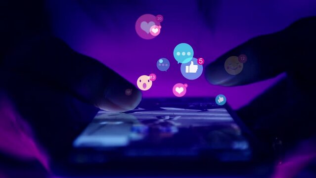 Finger of woman touching scroll page app on mobile phone.In a room with blue and purple neon tones.concept Social media marketing icon application hashtag message text