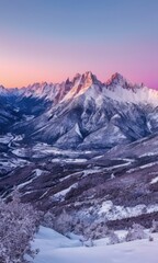 Stunning Winter Sunset over Snowy Mountain Peaks