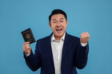 Immigration. Excited man with passport on light blue background