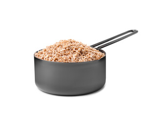 Dry wheat groats in scoop isolated on white