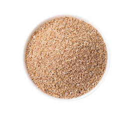 Dry wheat groats in bowl isolated on white, top view