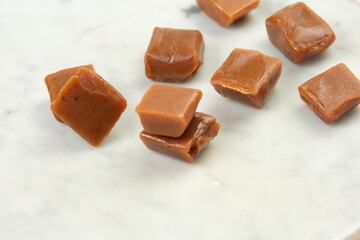 Caramel candies on a white background.