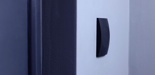 Magnetic door lock on light wall. Home security