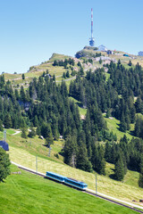 View on Rigi mountain and Arth&ndash;Rigi railway line rack railway in Swiss Alps portrait format in Switzerland