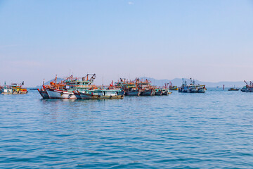 Fototapeta premium Fishing Boats Floating Peacefully on a Sunny Day