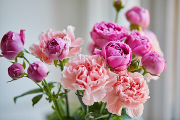 Bouquet of lilac roses and pink carnations. Close up