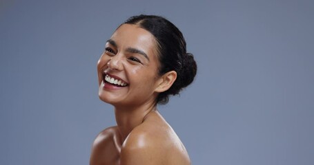 Beauty, skincare and face of happy woman on blue background with confidence, wellness and cosmetics. Dermatology, aesthetic and portrait of person laugh with natural glow and healthy skin in studio