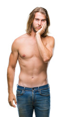 Young handsome shirtless man with long hair showing sexy body over isolated background thinking looking tired and bored with depression problems with crossed arms.