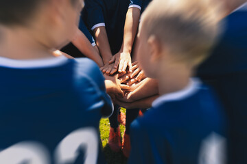 Happy Children Sports Team Stacking Hands. Kids Having Fun During Outdoor Physical Education...