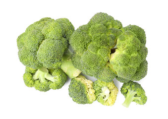 Pile of fresh raw green broccoli isolated on white, top view