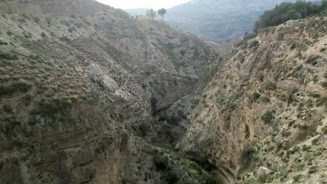 Drone footage showing the gorge at the Tablate Bridge heading towards the A44 motorway viaduct, at Beznar, Lecr&iacute;n Valley, Granada, Spain.