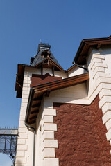 The turret and detail of the wrought-iron fence of the terrace of the old mansion