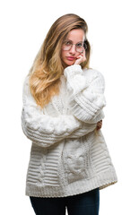 Young beautiful blonde woman wearing winter sweater and sunglasses over isolated background thinking looking tired and bored with depression problems with crossed arms.